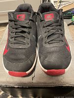 Top view of both shoes showing laces, mesh uppers, Swoosh tips