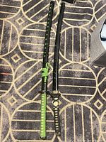 Pair of wakizashi swords in scabbards side by side