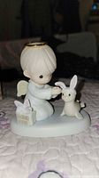 Front view of figurine showing angel and rabbit