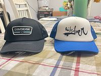 Front view of both Quiksilver caps