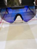 Front view showing shield design and blue mirrored lens