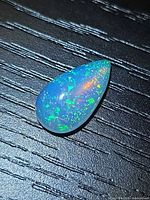 Pear-shaped opal cabochon showing play-of-color