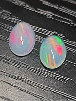 Two views of the oval cabochon Ethiopian jelly opal showing multicolor play-of-color
