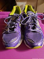 Front view of both shoes showing toe boxes, laces, and general wear