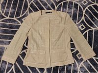 Full view of front of jacket laid flat