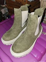 pair of olive green suede Chelsea ankle boots angled view
