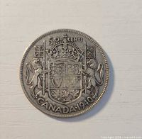 Reverse of 1940 Canada 50-cent coin showing Coat of Arms