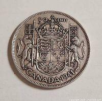 Reverse showing Coat of Arms and date