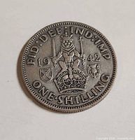Reverse of 1942 one shilling coin showing Scottish crest and date