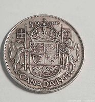 Reverse of 1944 Canadian 50-cent coin with Royal Coat of Arms