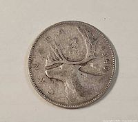 Reverse side showing caribou design and 1949 date
