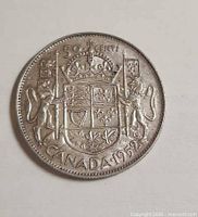 Reverse side showing Canadian coat of arms and date 1952