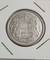 Reverse showing Canadian coat of arms and date 1957