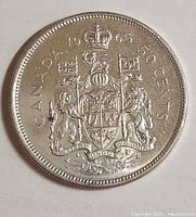 Reverse side showing Canadian Coat of Arms and date 1965