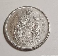 Reverse showing Canadian coat of arms and date