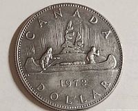 Reverse showing Voyageur and Indigenous paddler in canoe, year 1972 and CANADA DOLLAR legend