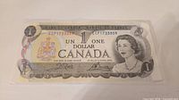 Front of 1973 Canadian $1 note showing Queen Elizabeth II and serial number