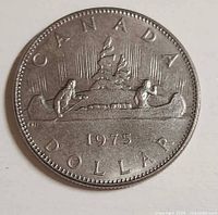 Reverse of 1975 Canada dollar showing Voyageur canoe design