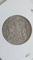1980 Canada 50-cent coin reverse showing Canadian Coat of Arms in holder