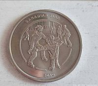 Obverse of 2010 Canadian Tire token showing skating scene
