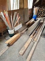 overview showing beams, boards and bucket of trim pieces