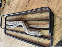 Top view of black steel cargo carrier platform wrapped hitch shank beside