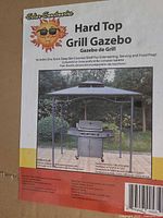 Package label showing Solar Sanctuaries Hard Top Grill Gazebo with model and retailer information