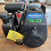 Front and side view of Honda GC160 engine with attached components