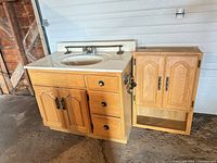 Vanity base with sink and matching wall cabinet shown together
