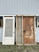 Front view of both doors standing side by side showing overall design and condition