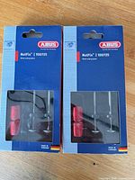 Front view of two sealed ABUS NutFix 100/135 boxes