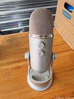 Microphone rear showing gain and pattern controls, stand attached
