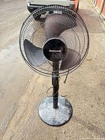 Full view of Honeywell pedestal fan showing base, pole and fan head
