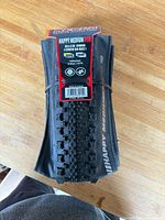 Front of folded tire with product tag visible
