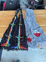Both scarves laid flat showing designs and colors