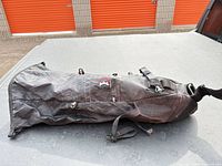 Full view of saddlebag showing exterior fabric, straps and overall wear