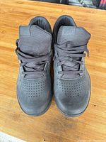 Front view of pair of black Shimano Ultra Tread cycling shoes