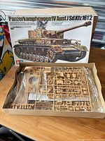 Box with open lid showing unassembled sprues and instruction sheet