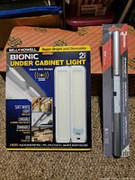 Front view of Bell + Howell Bionic light box and Richelieu LED bar package