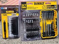 Front view of both DeWalt bit sets, 37-piece and 13-piece, unopened