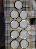 Top view of eight plates laid out on table