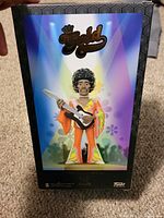 Front of boxed Funko Gold Jimi Hendrix figure showing artwork and logo