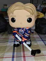 Front view of Wayne Gretzky Funko Pop! figure holding hockey stick
