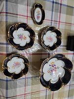 Full set showing four scalloped bowls and one oval tray