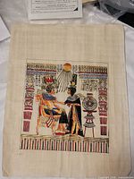Full view of papyrus artwork with certificate partially visible