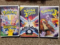 Front covers of all three Pokémon VHS tapes