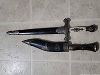 Overall view of both knives in scabbards
