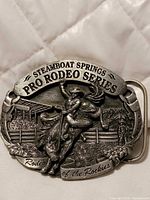 Front view showing bronc rider design and text