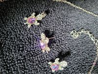 Necklace turtle pendant and stud earrings showing stones and silver finish