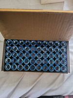Open box showing 50 sockets arranged in rows